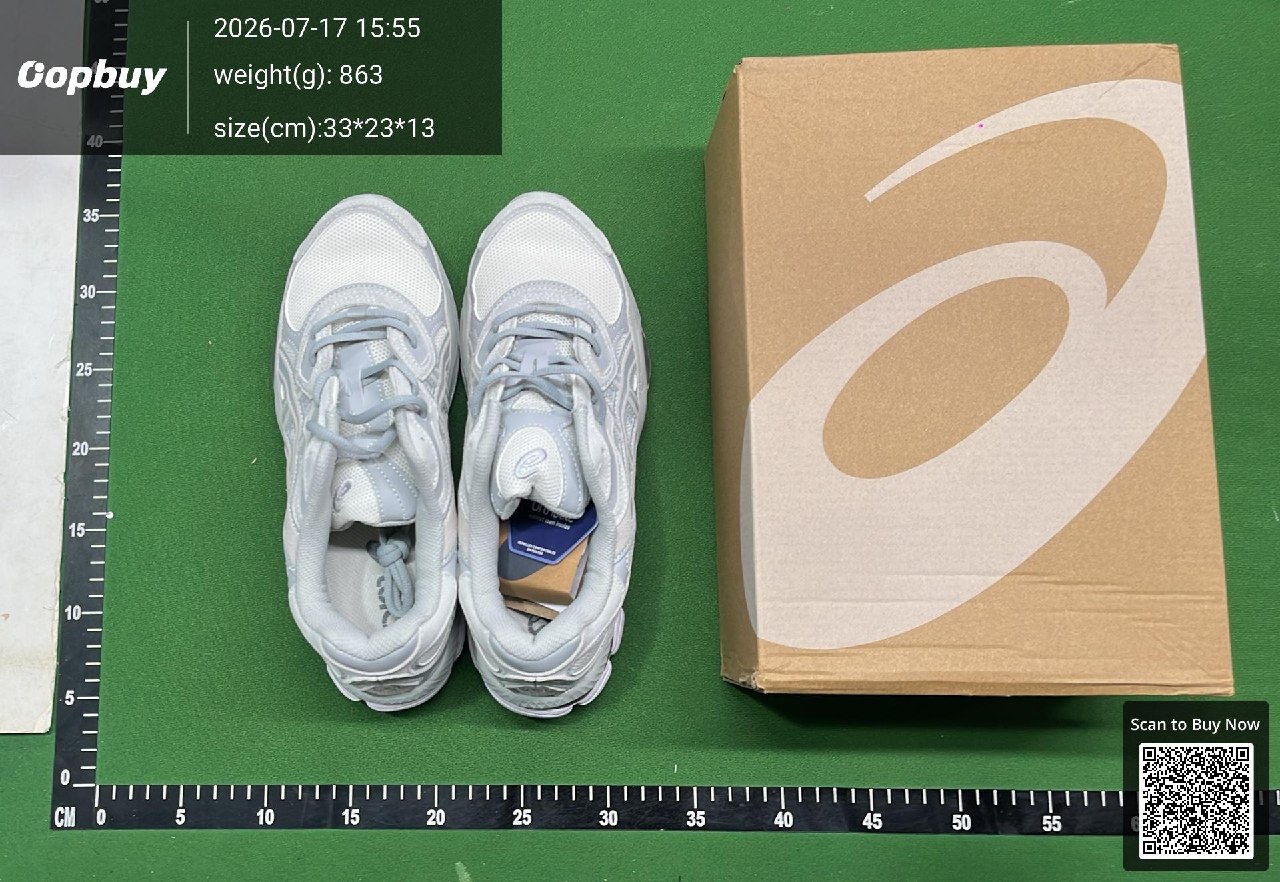 Grey shoes and their box on the warehouse inspection mat